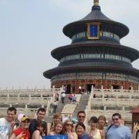 Group photo with flag at temple